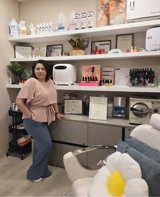 Nail technician in Winnipeg salon with sterilized tools ensuring safe and hygienic manicure