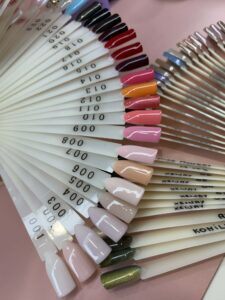 Professional nail polish shades display with multiple colors for manicure